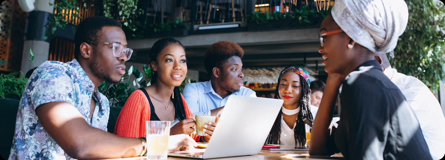 Dexwin team members collaborating around a table
